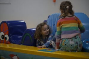 Photo of smiling children in soft play