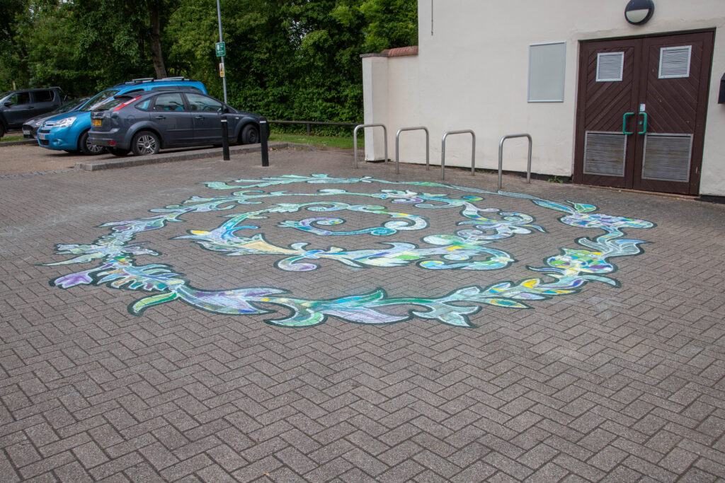 an image of a completed chalk art, outdoor.